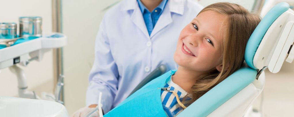 Smiling Kid getting ready for a dental checkup