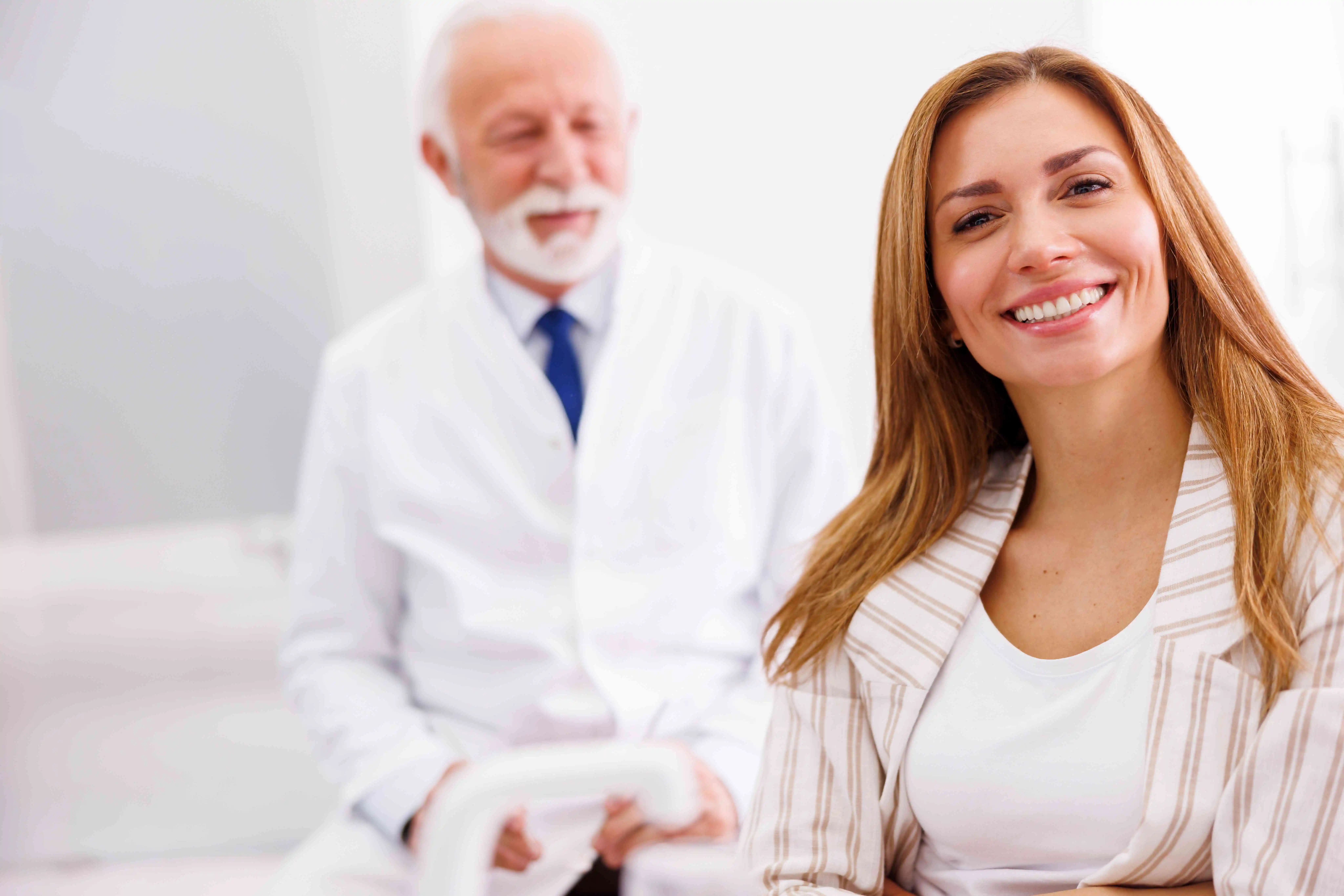 woman with Dentist for tooth replacement